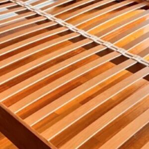 Cream postureslat rubbers on bed with postureslats