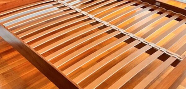 Cream postureslat rubbers on bed with postureslats