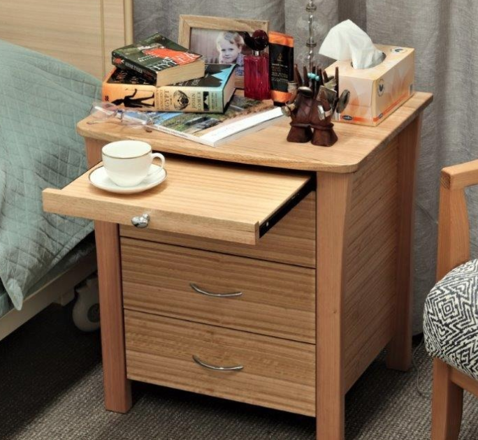 Aged care bedside table with the breakfast tray extended